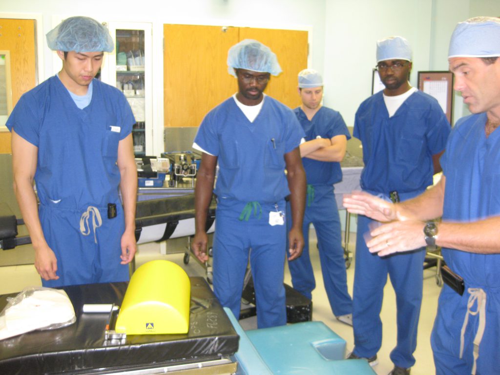 Our Program Director, Daniel Resnick, M.D. (far left) teaching residents and staff advanced O.R. techniques