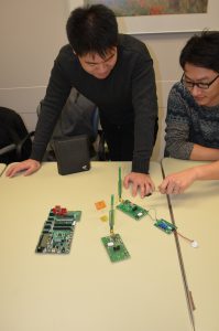 Lab members presenting a design for wireless power for powering and charging a smart shunt.