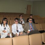 Residents using 3d glasses for lecture about 3d video in microscropes