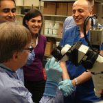 Dr. Hernesniemi touring the research labs