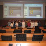 Dr. Zang poses with Dr. Dempsey and other members of the department