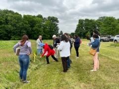 Diane Dempsey, PhD, points out a biospecimen during the native plant walk at the Oneida Nation.