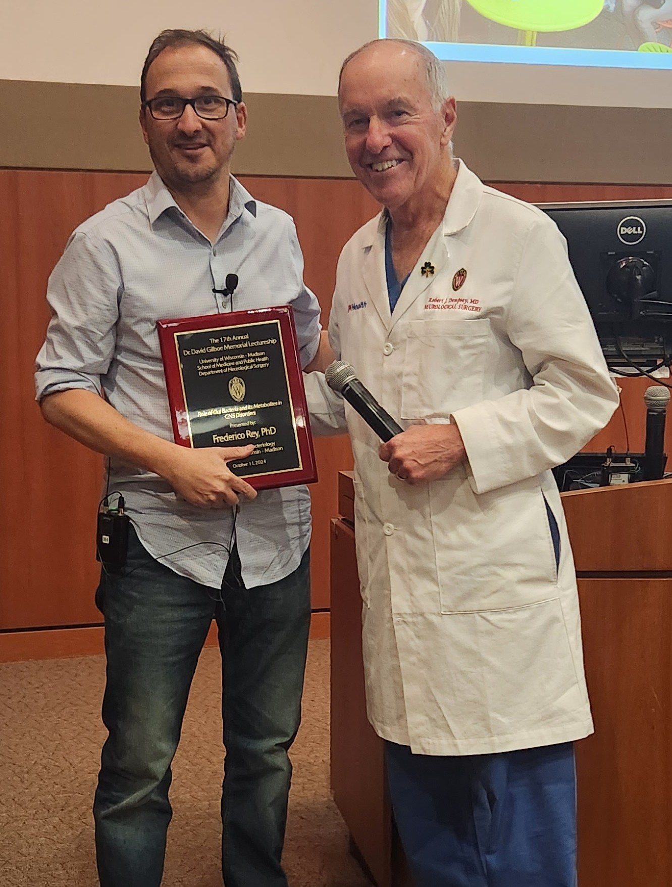 Dr. Rey and Dr. Dempsey, Dr. Rey presented with an award